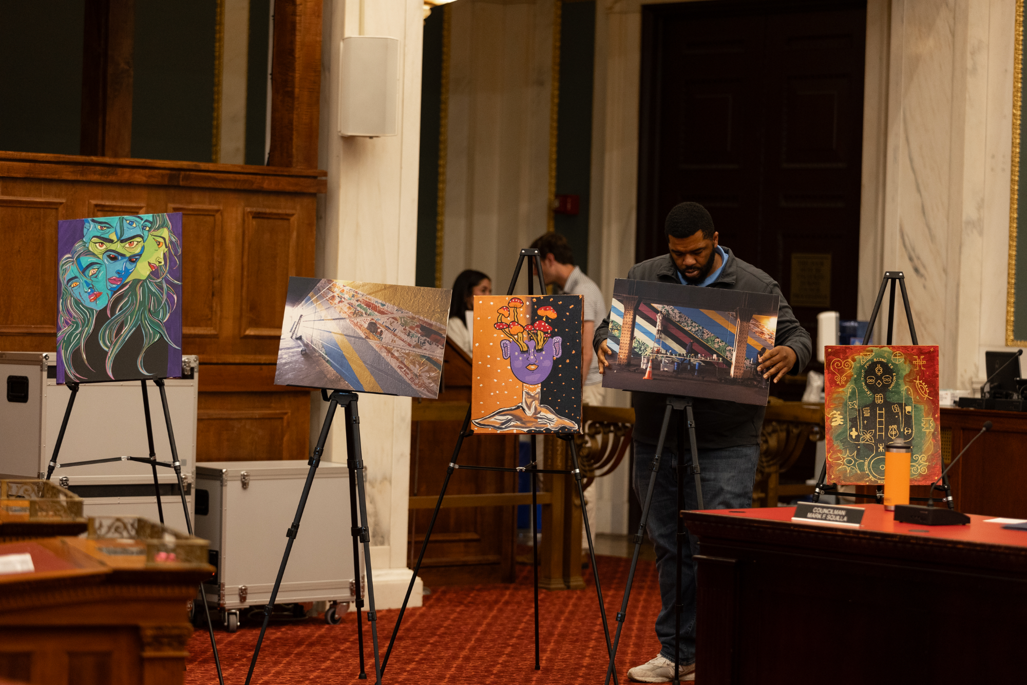 Mural Arts Philadelphia displays art pieces during a hearing with the Special Committee on Kensington at City Hall