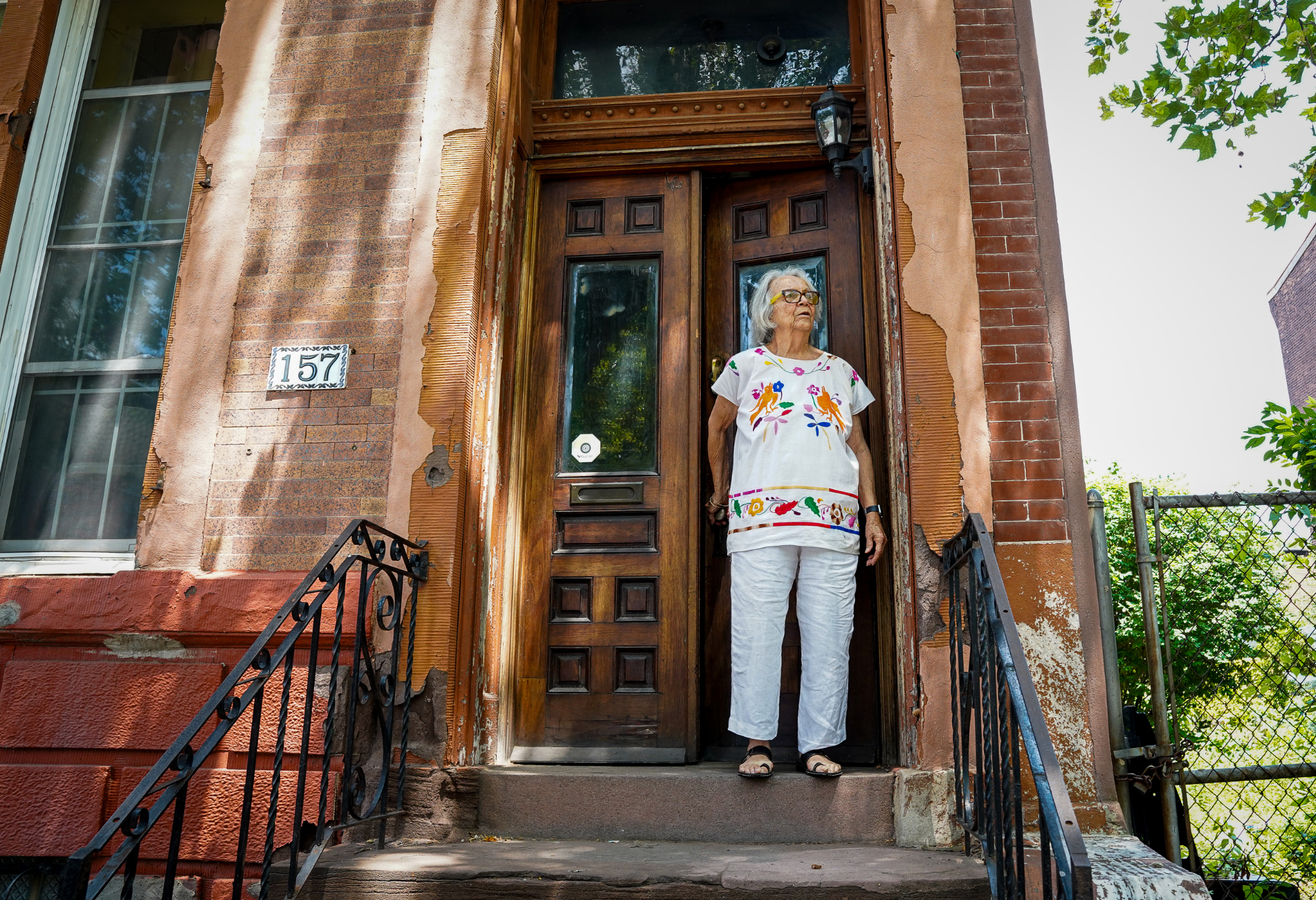 Pat De Carlo on her front steps in Norris Square