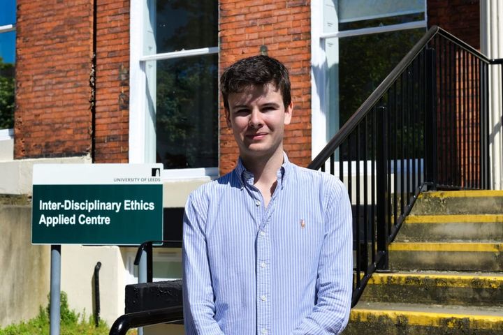 Alex Fisher standing in front of the IDEA Centre in Leeds. 