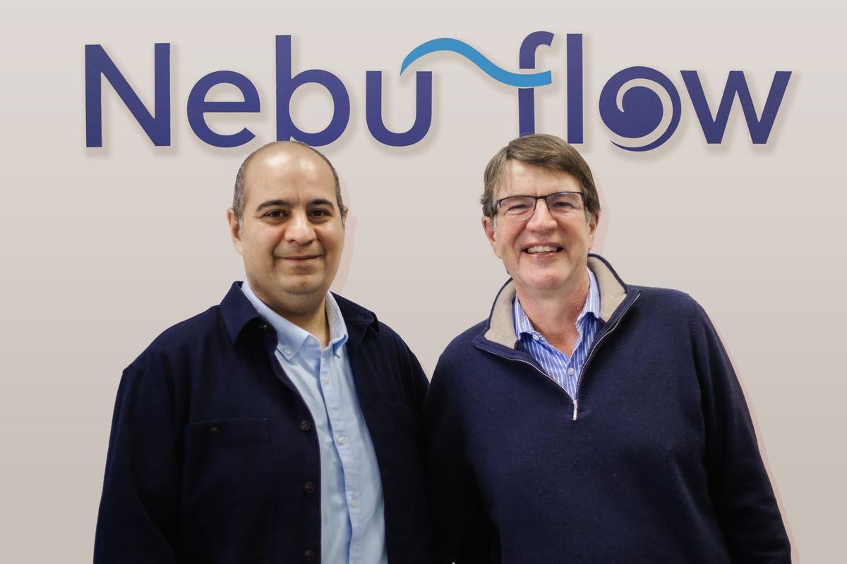 Dr Elijah Nazarzadeh (CEO) and Dr John Pritchard (Chair) stand in front of a wall with the Nebu-Flow logo