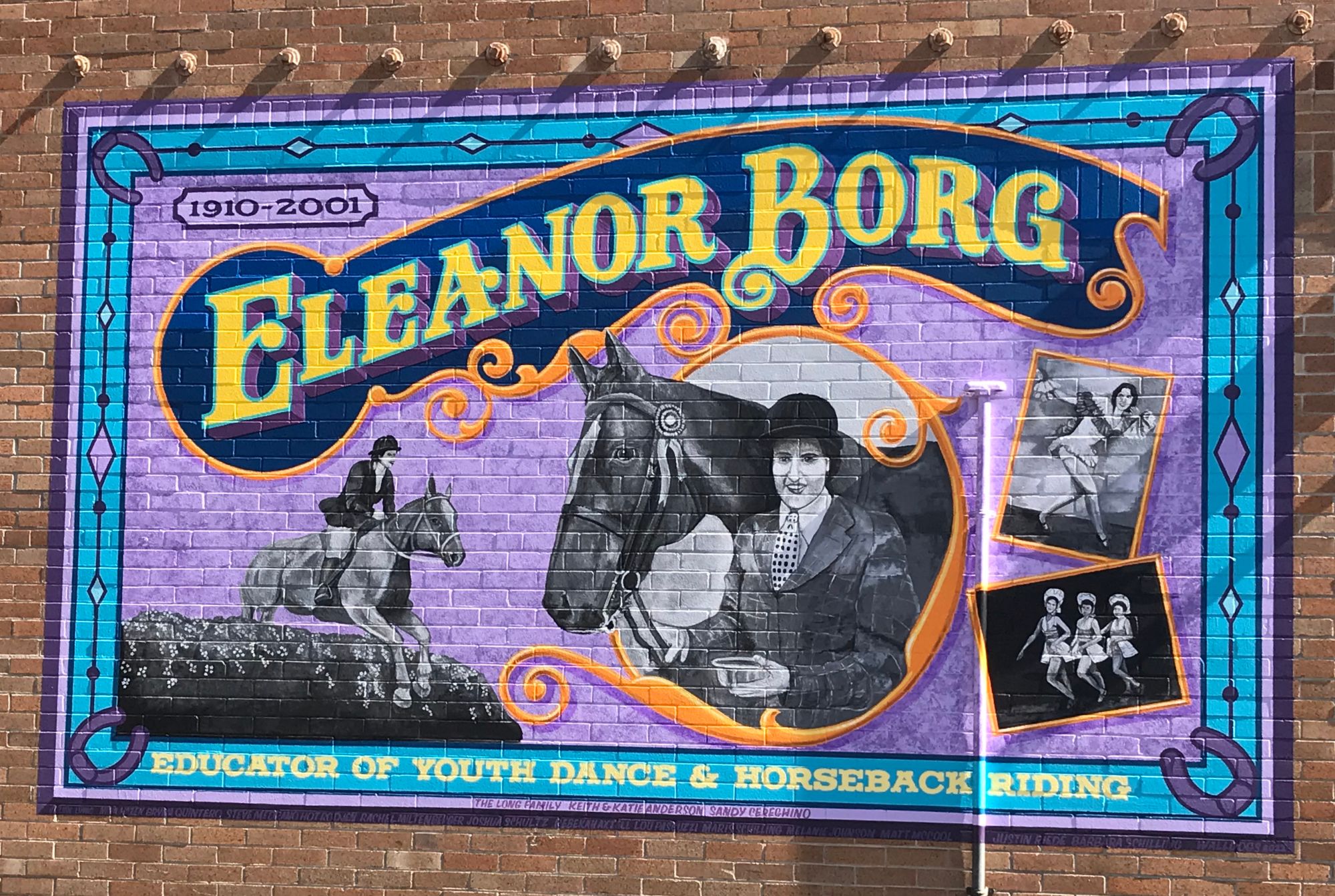 Painted mural on a brick wall.