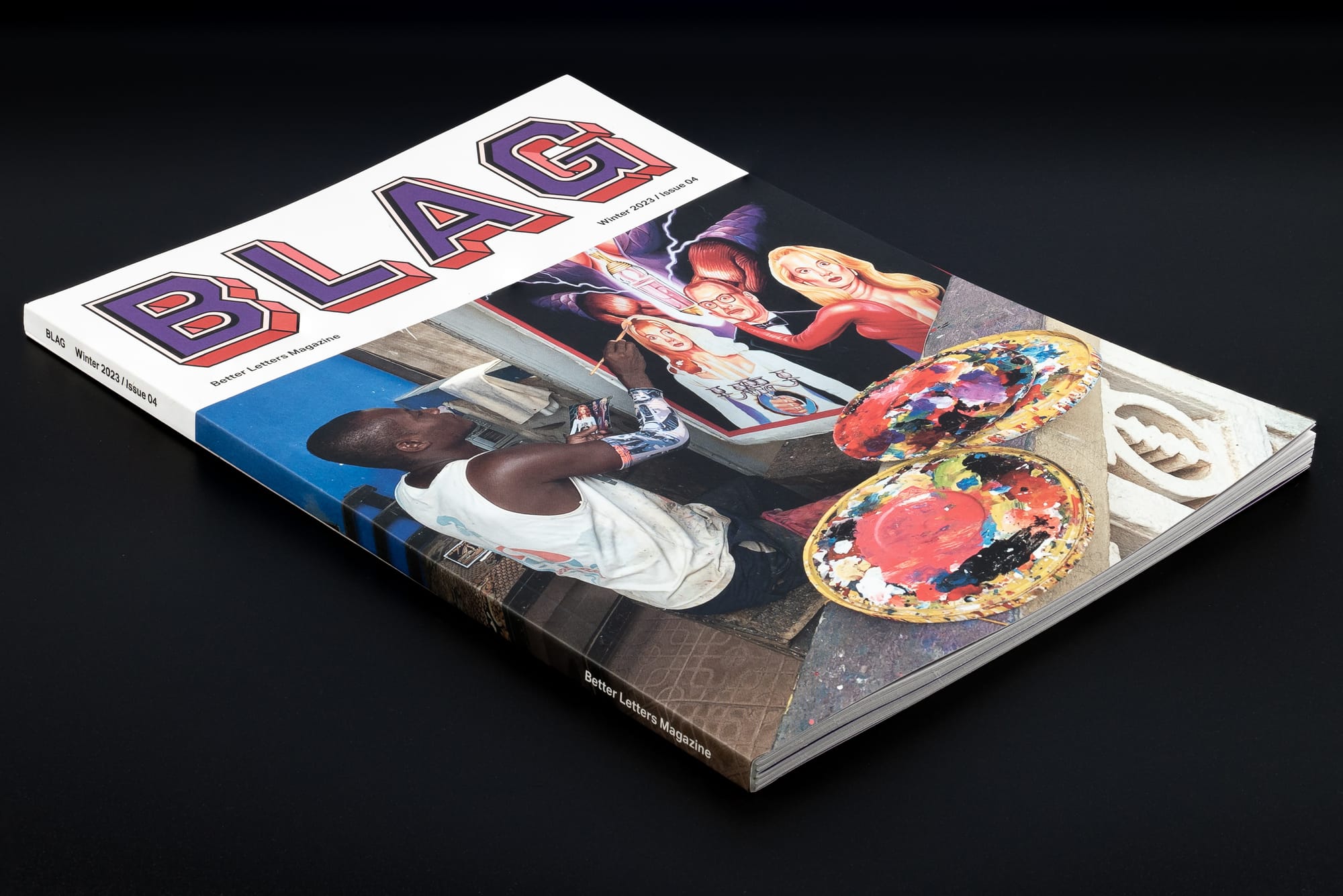Magazine cover with a masthead that says 'BLAG' and a man sat down painting a picture underneath.