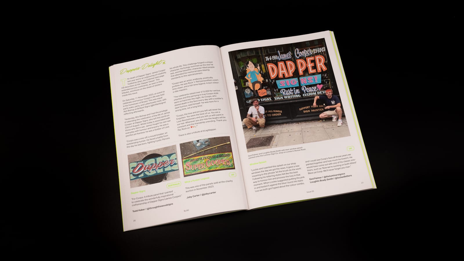 Magazine open at a spread with about 50% of the space taken up by text and the other 50% consisting of two small photos of hand-painted panels, and a bigger photo of a painted shop window with two men crouched in front of it. Each of these pieces reference Dapper Signs.