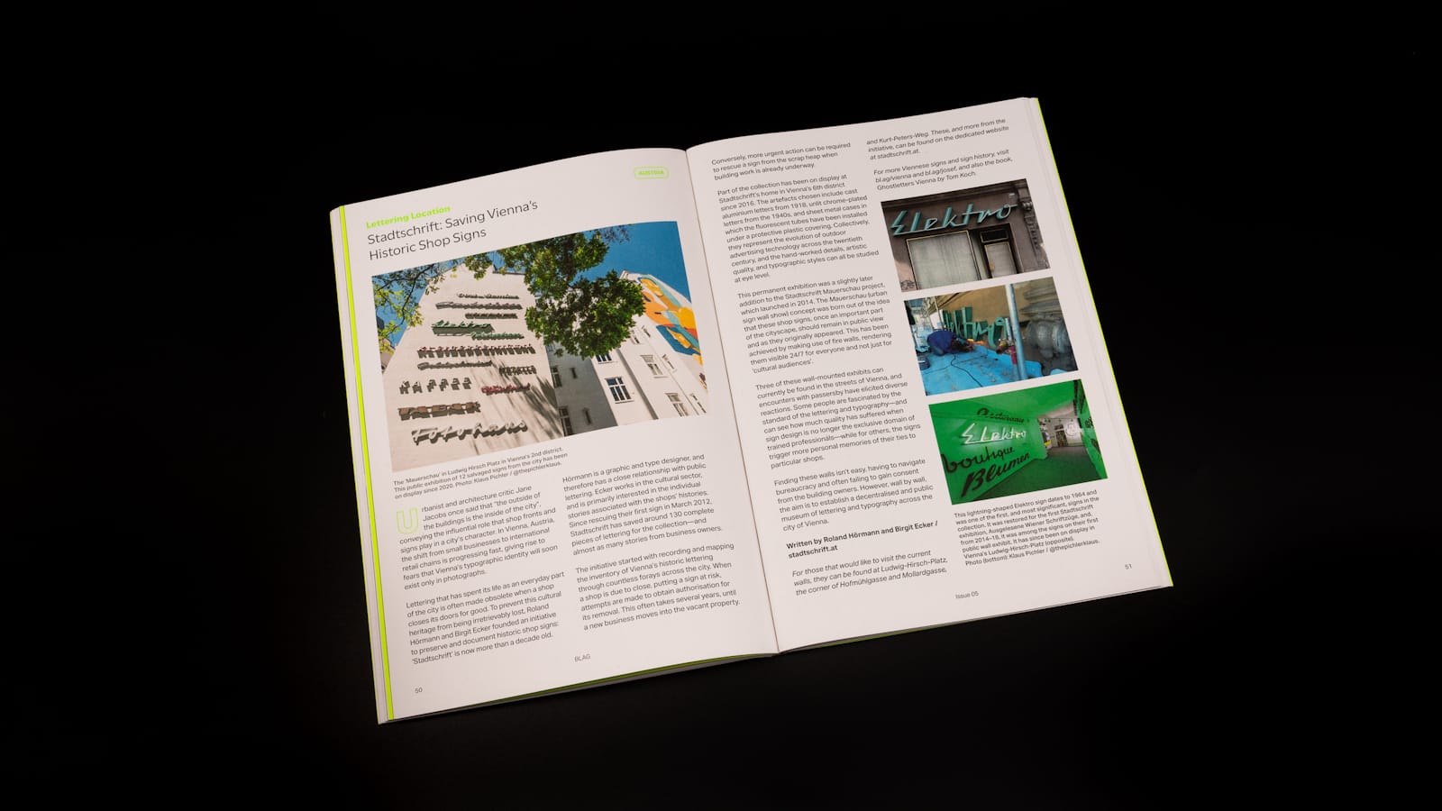 Photo of a magazine opened at a spread with text and pictures about various forms of mounted signage.