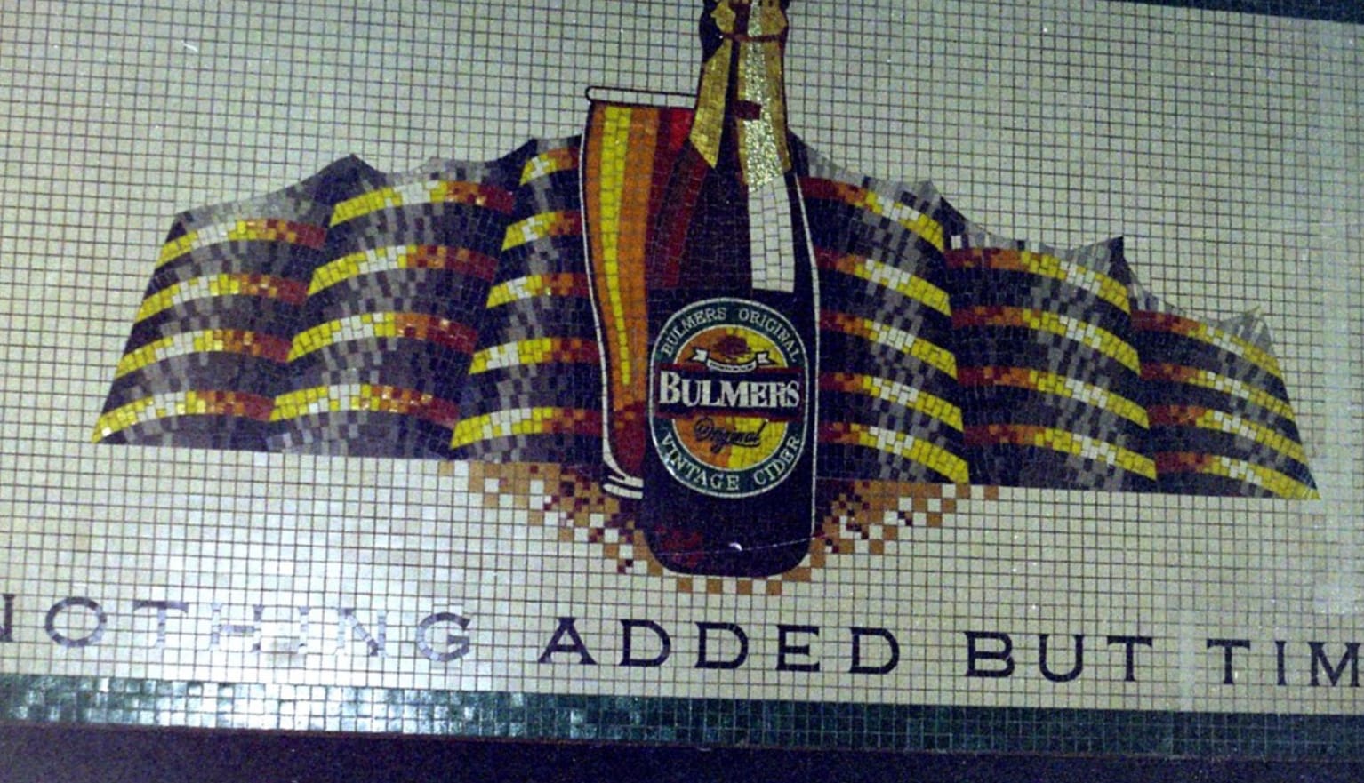 Mosaic advertising Bulmers cider with a cider bottle and pint of cider front and centre.