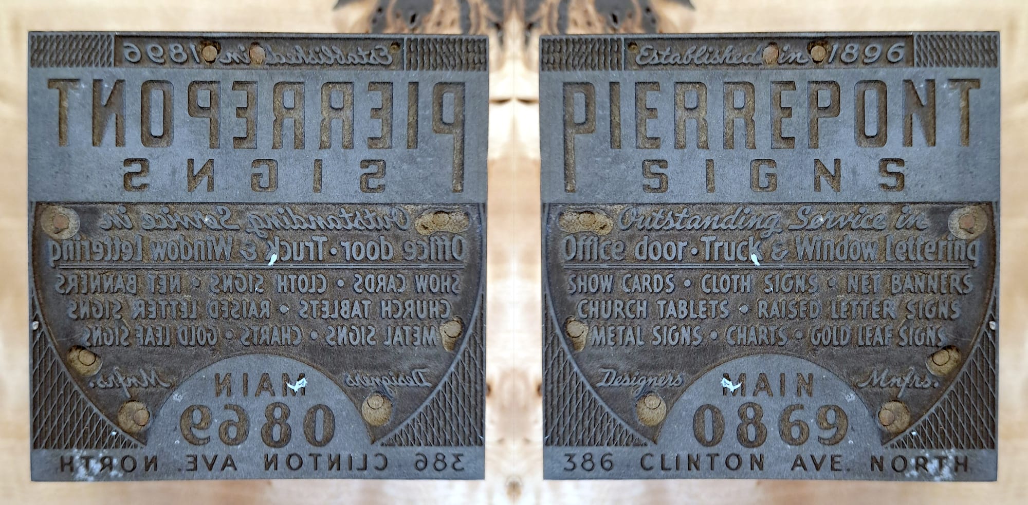 Face of a printing block shown as it is and then flipped horizontally to read correctly. It is an advertisement for the various sign services offer by Pierrepont Signs.