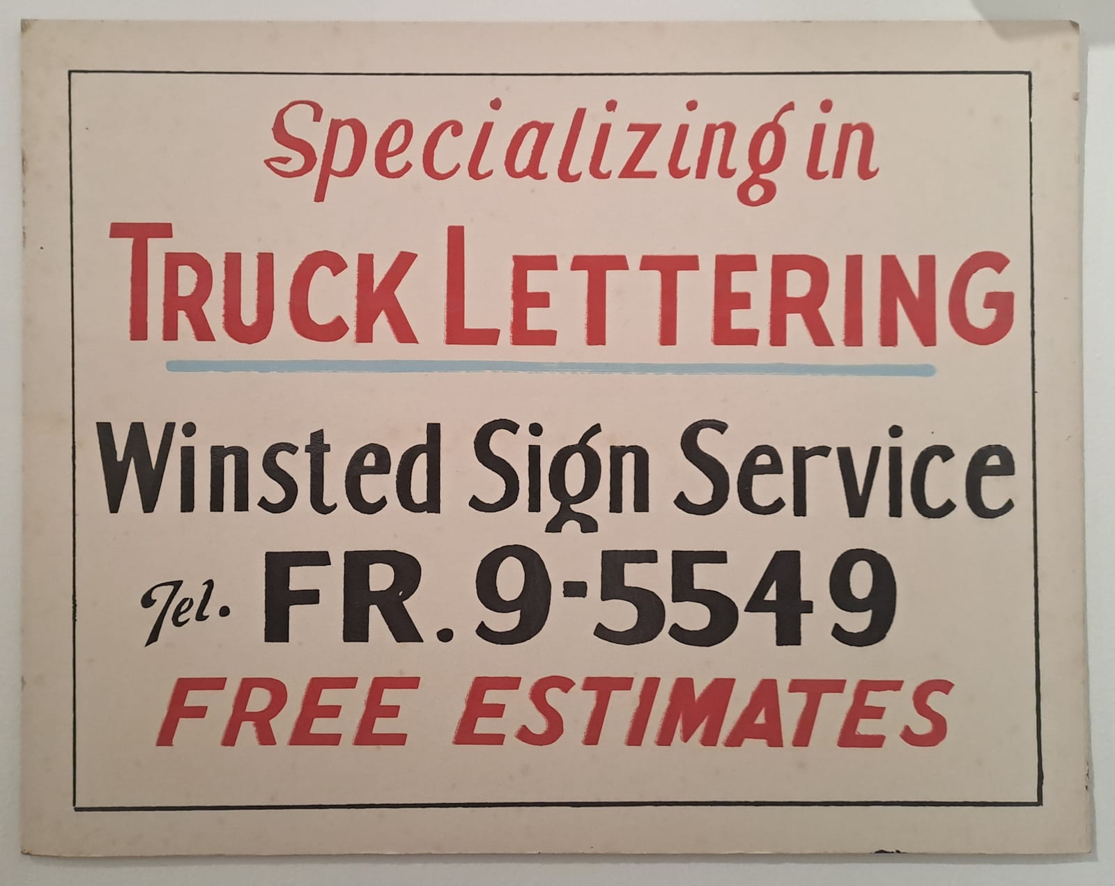 Simple hand-lettered sign with five lines of copy in red and black advertising the Winsted Sign Service.