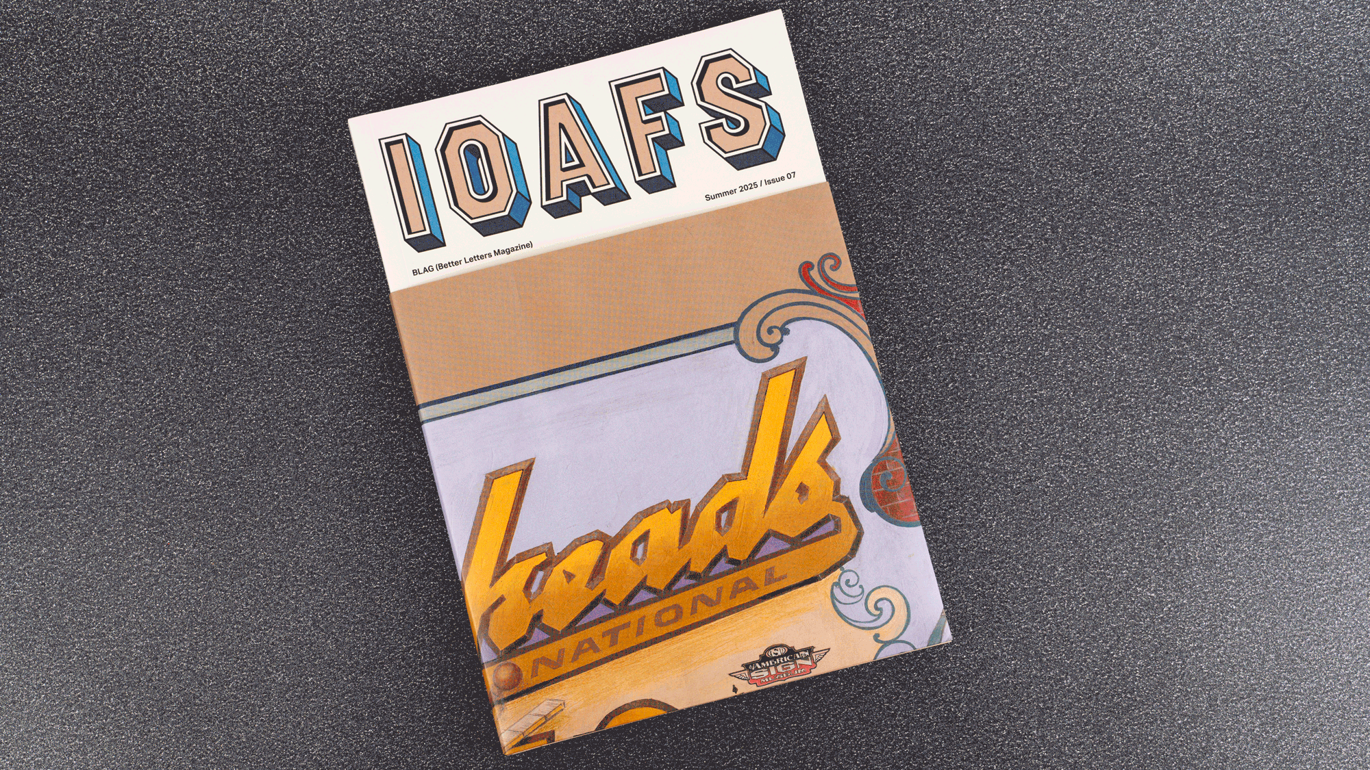 GIF showing the process of removing the cover wrap on a magazine to reveal a large hand-lettered poster whose headline is "Letterheads 50".