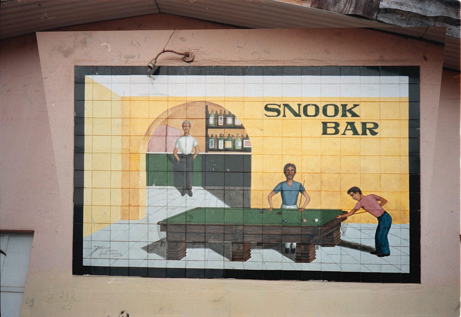 Large ceramic mural dominated by a pictorial of a barroom scene with a person standing at the bar and two people playing snooker in the foreground. A sign within the scene reads "Snook Bar".