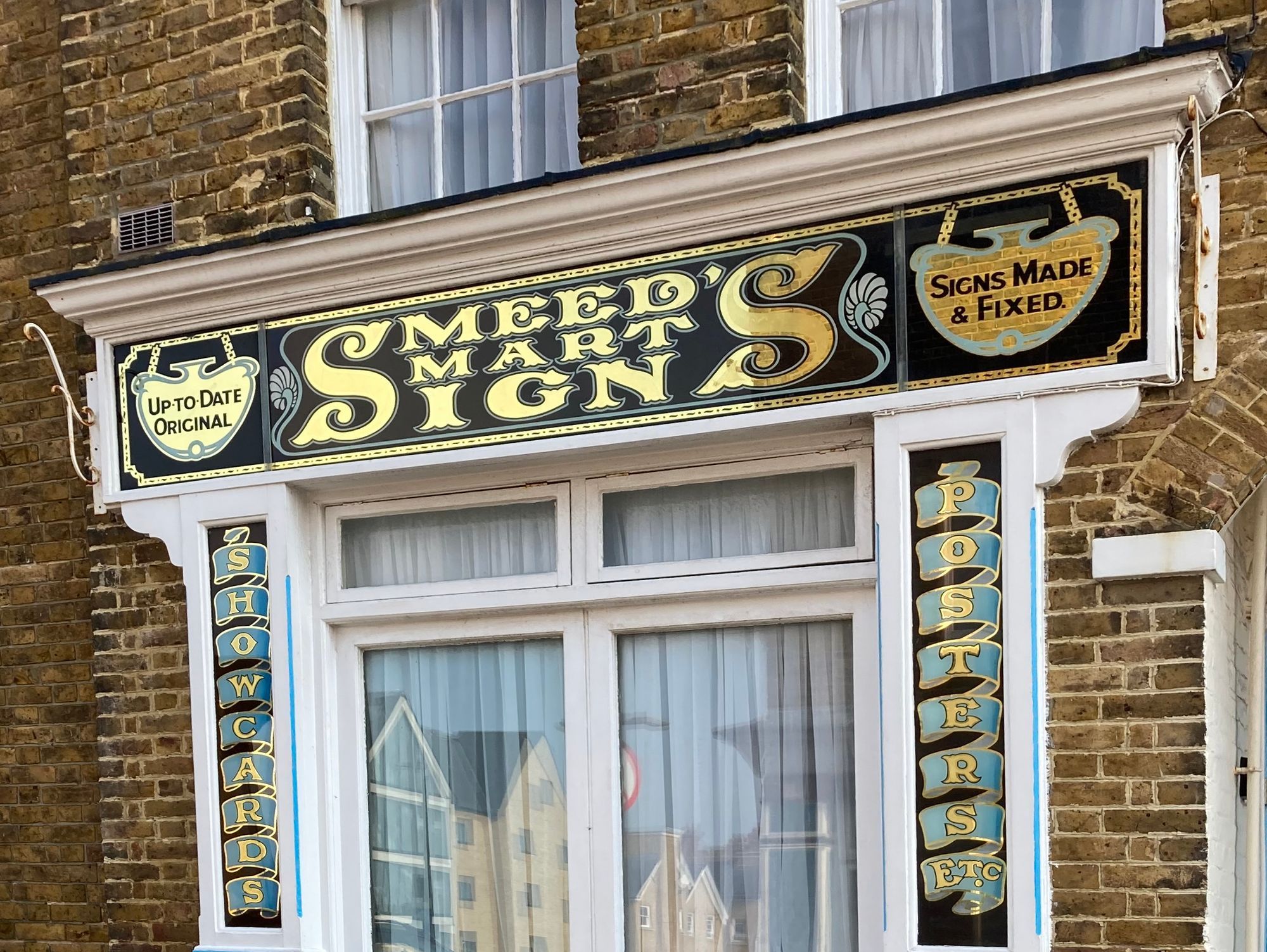 Gilded glass shopfront.