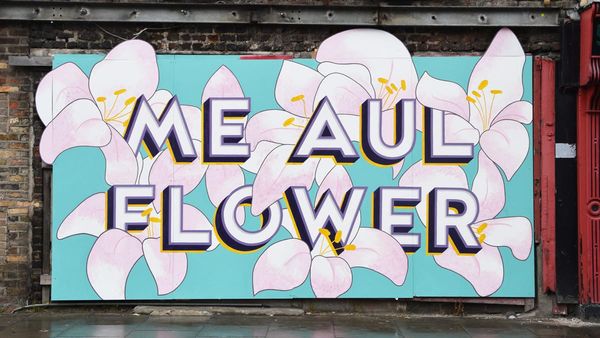 Mural with block and shade lettering for 'Me Aul Flower' set within an array of pale pink flowers. 