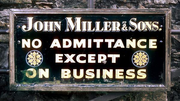 Framed hand-painted and gilded sign advertising "John Miller & Sons. No admittance except on business".