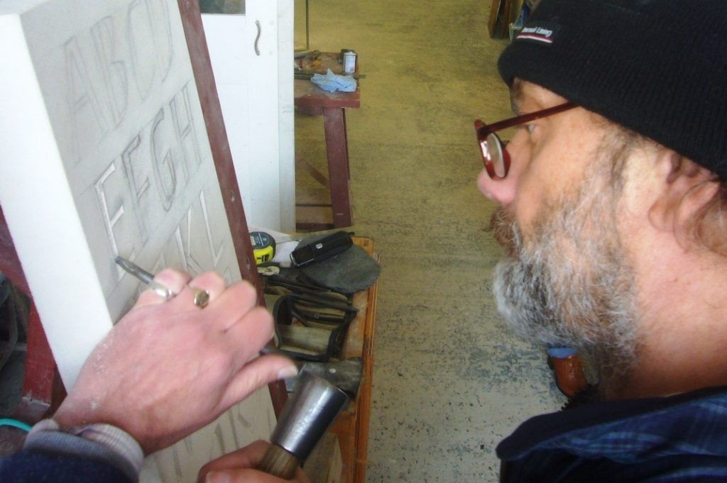 Chris Elsey demonstrates letter cutting