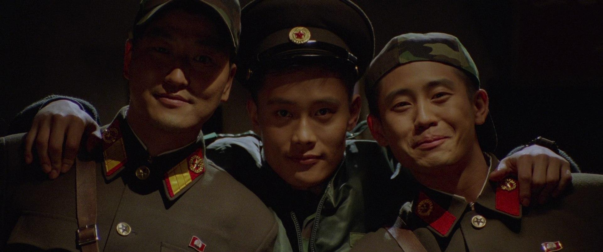 North and South Korean soldiers, including Song Kang-ho and Lee Byung-hun, pose together for a picture in Joint Security Area