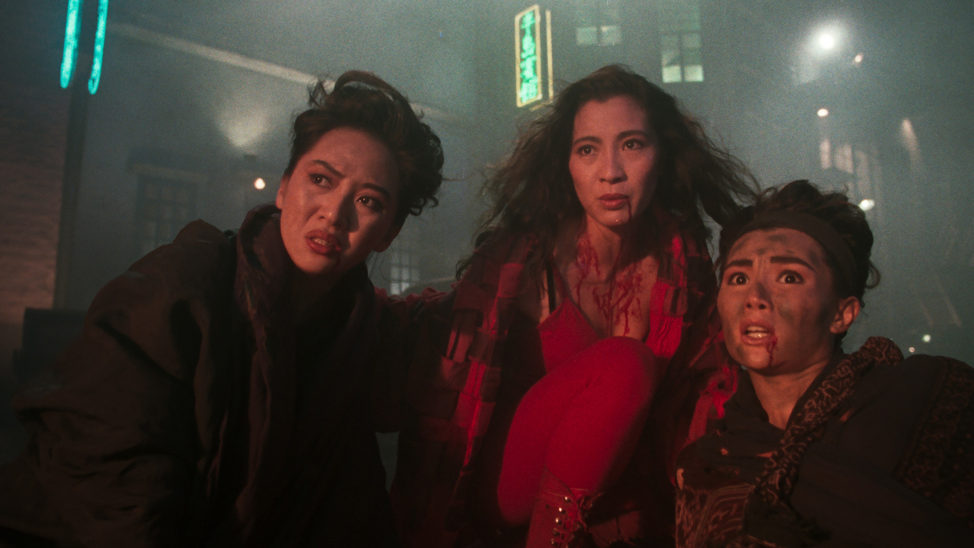 Anita Mui, Michelle Yeoh, and Maggie Cheung look shocked as superheroes in The Heroic Trio