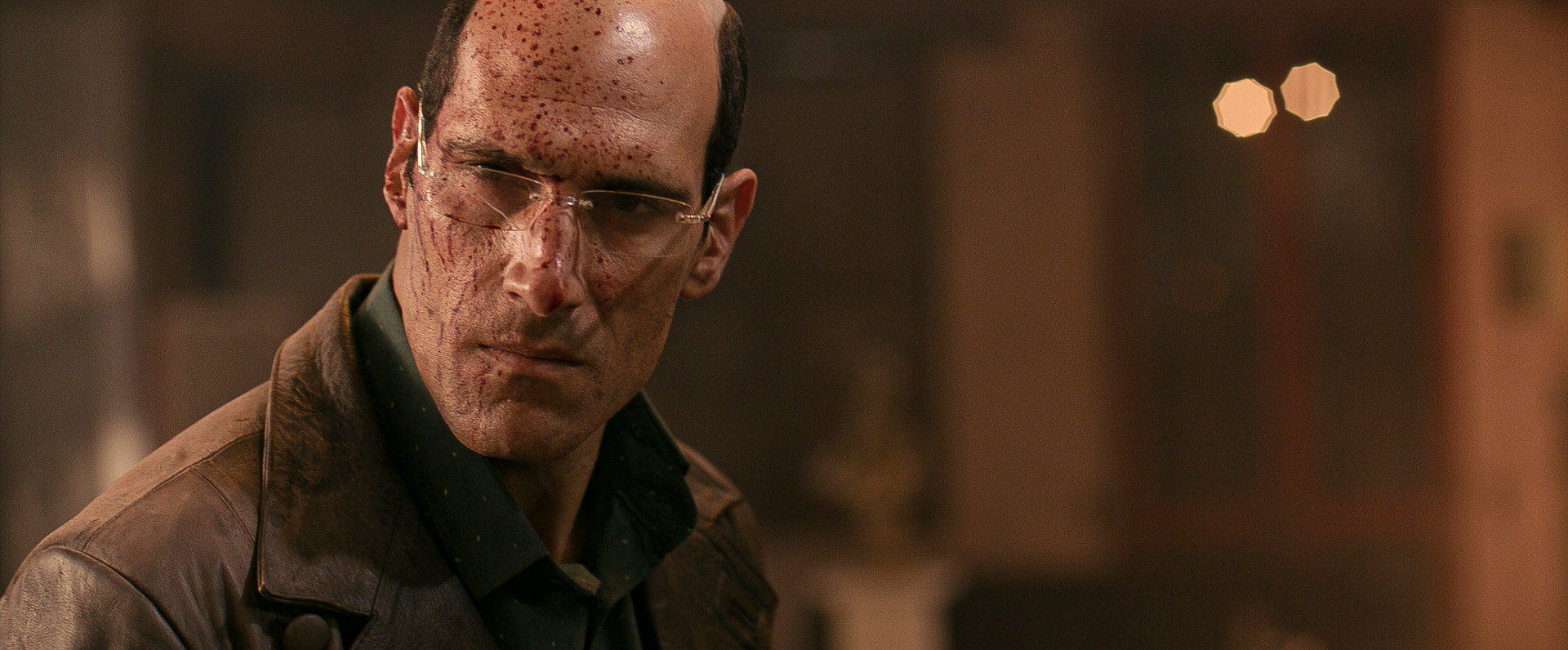 Marko Zaror, with blood splattered on his face, in Diablo