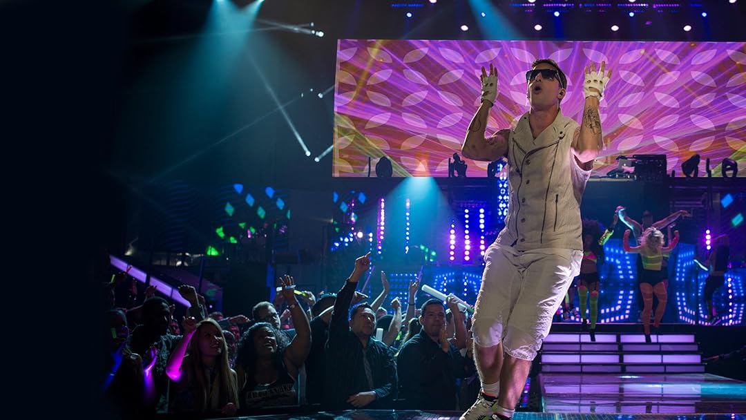 Andy Samberg peacocks on stage in Popstar: Never Stop Never Stopping