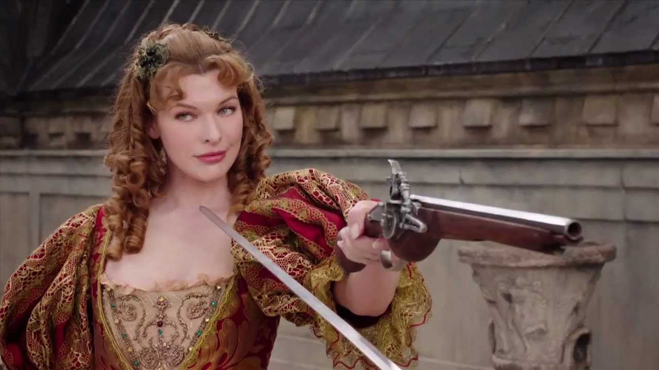 Milla Jovovich, smirking and holding a pistol as Milady