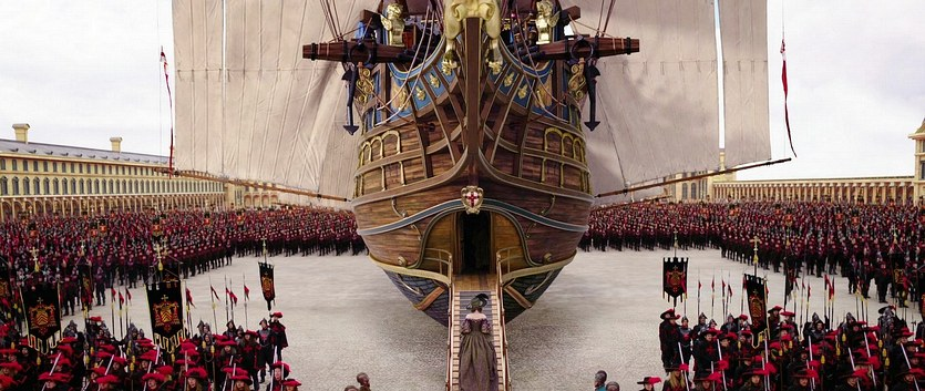 A massive crowd outside around an airship in The Three Musketeers