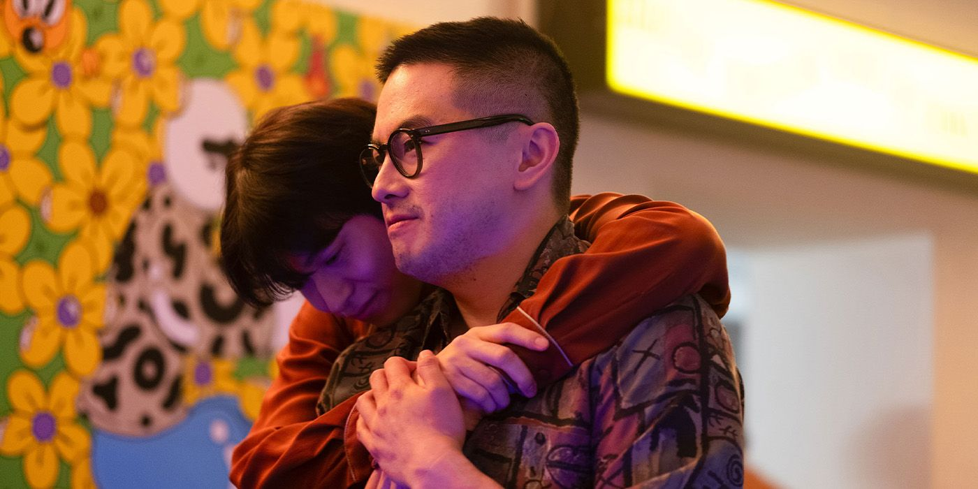 Bowen Yang and Hang Gi-Chan embrace in The Wedding Banquet