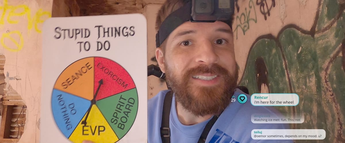 In Deadstream, Joseph Winter holds up a spinning wheel that says "Stupid Things To Do," with options of Seance, Exorcism (where the arrow is pointing), Spirit Board, EVP, and Do Nothing. Chat messages appear on the bottom right, including "i'm here for the wheel."