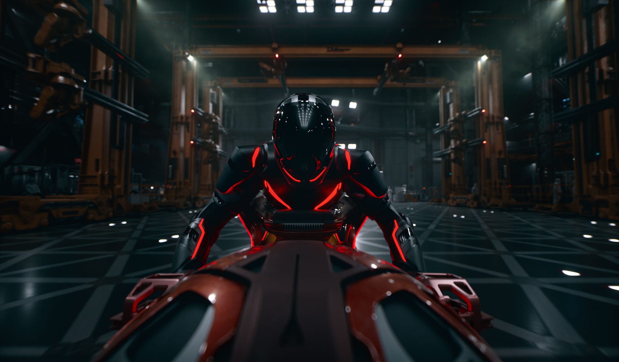 A person wearing a futuristic suit of armor rides a futuristic motorcycle in Tron: Ares