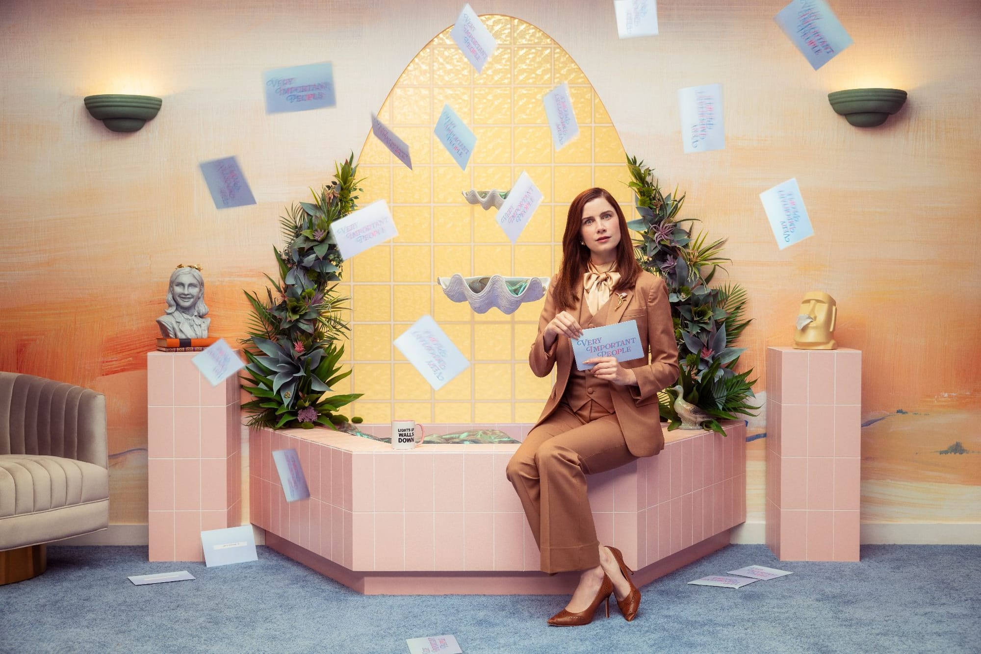 Vic Michaelis on the set of VIP, with paper cards flying all around them