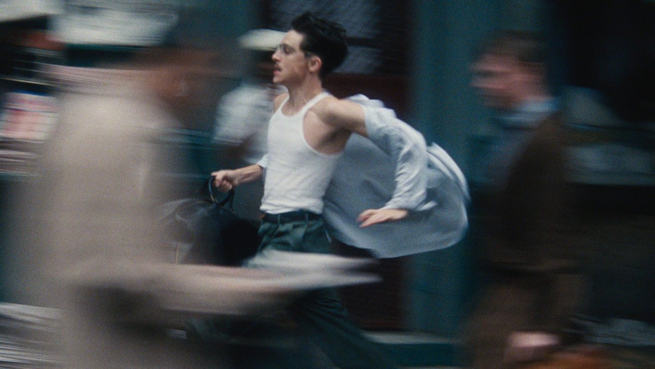 A blurry Chalamet runs through the streets of New York in Marty Supreme