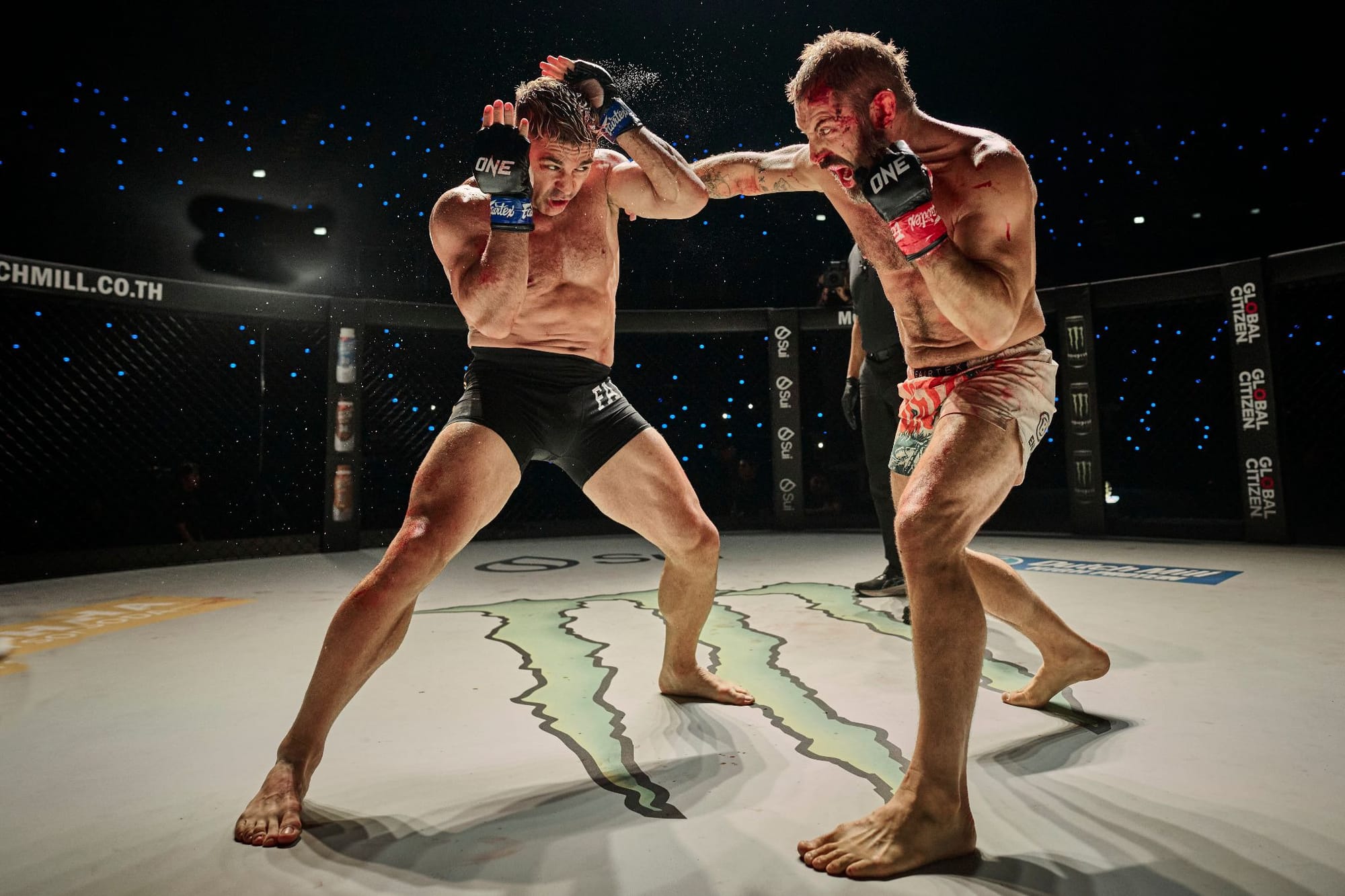 Daniel MacPherson and Bren Foster exchange blows in the Octagon in Beast