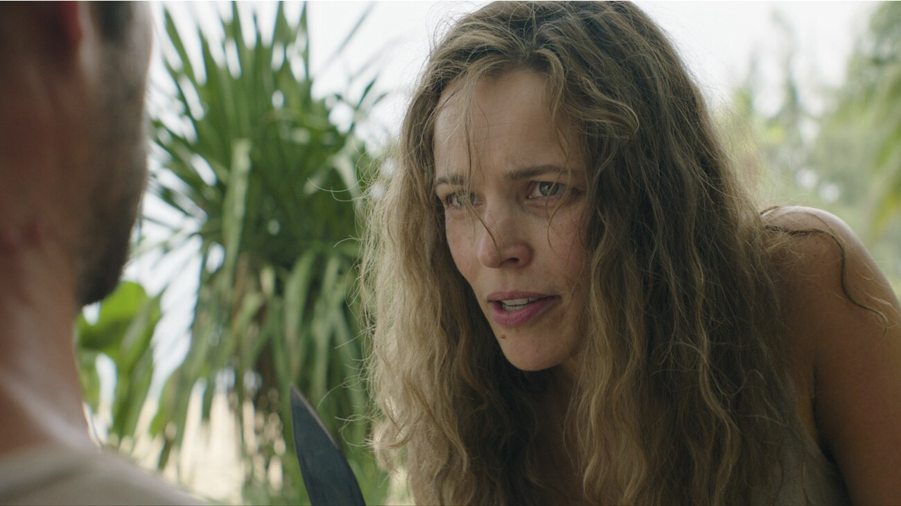 Rachel McAdams menacingly holds a knife towards Dylan O'Brien in Send Help