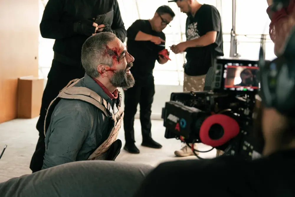A bloody Omar Chaparro on the set of Vengeance