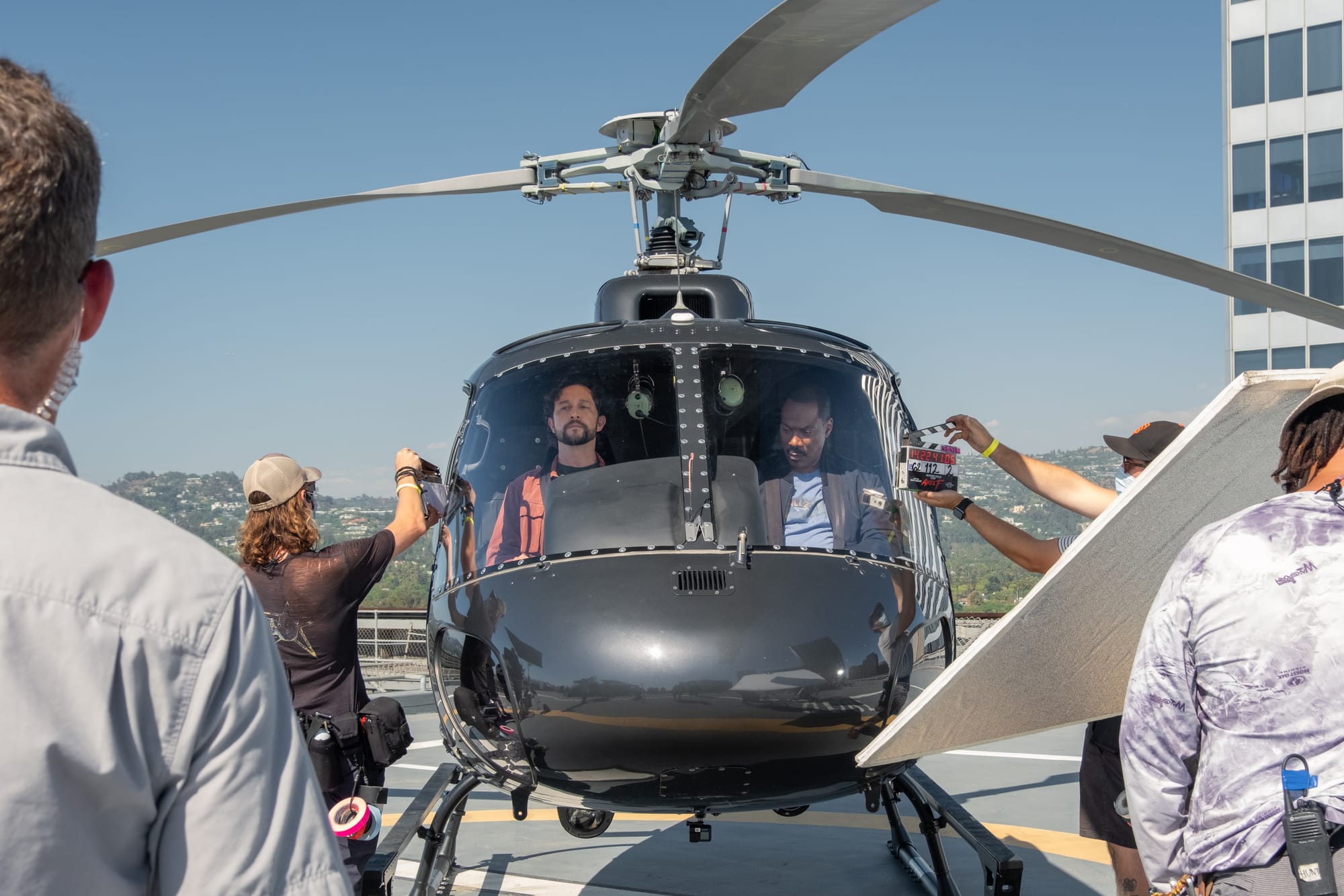 Eddie Murphy and Joseph Gordon-Levitt in a helicopter on the set of Axel F