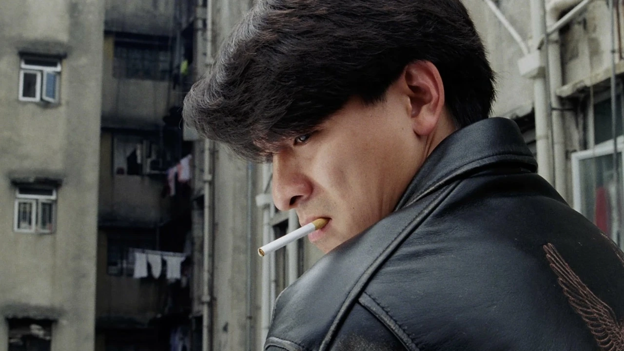 Andy Lau, smoking a cigarette and looking cool in a leather jacket, in Casino Raiders II
