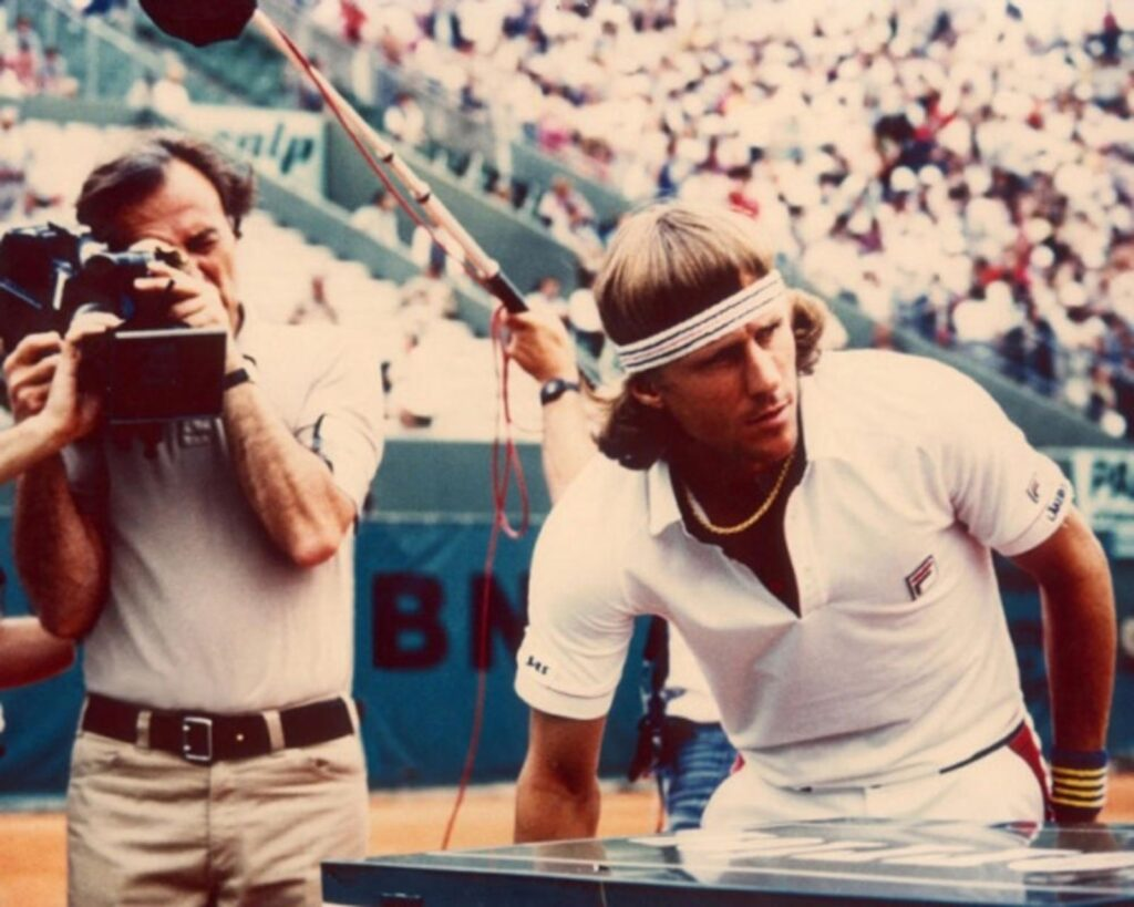 William Klein aiming his camera at Bjorn Borg at the French Open