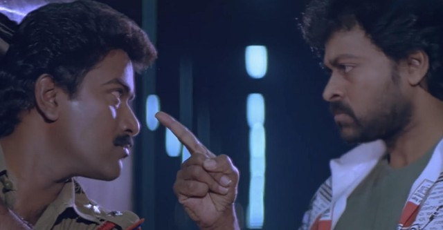 A man points his finger at another man in Gang Leader