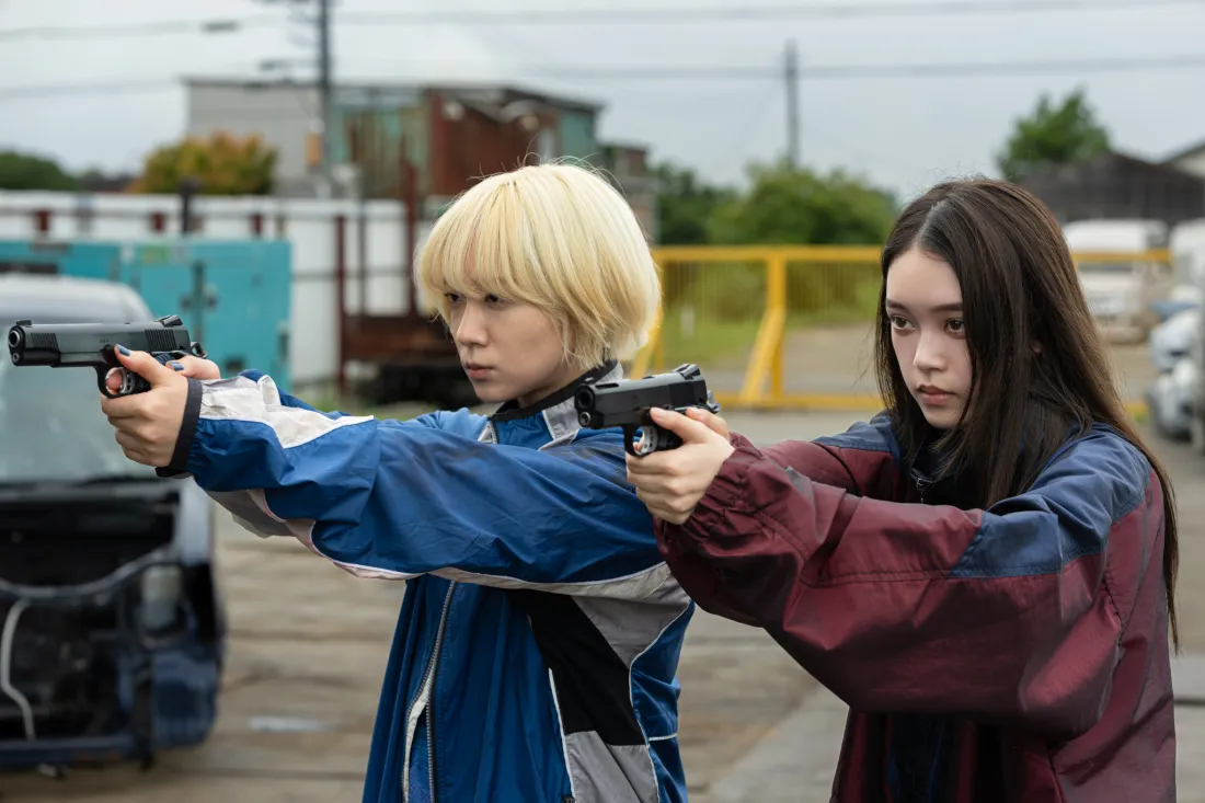 The Baby Assassins,with pistols drawn, are ready to roll