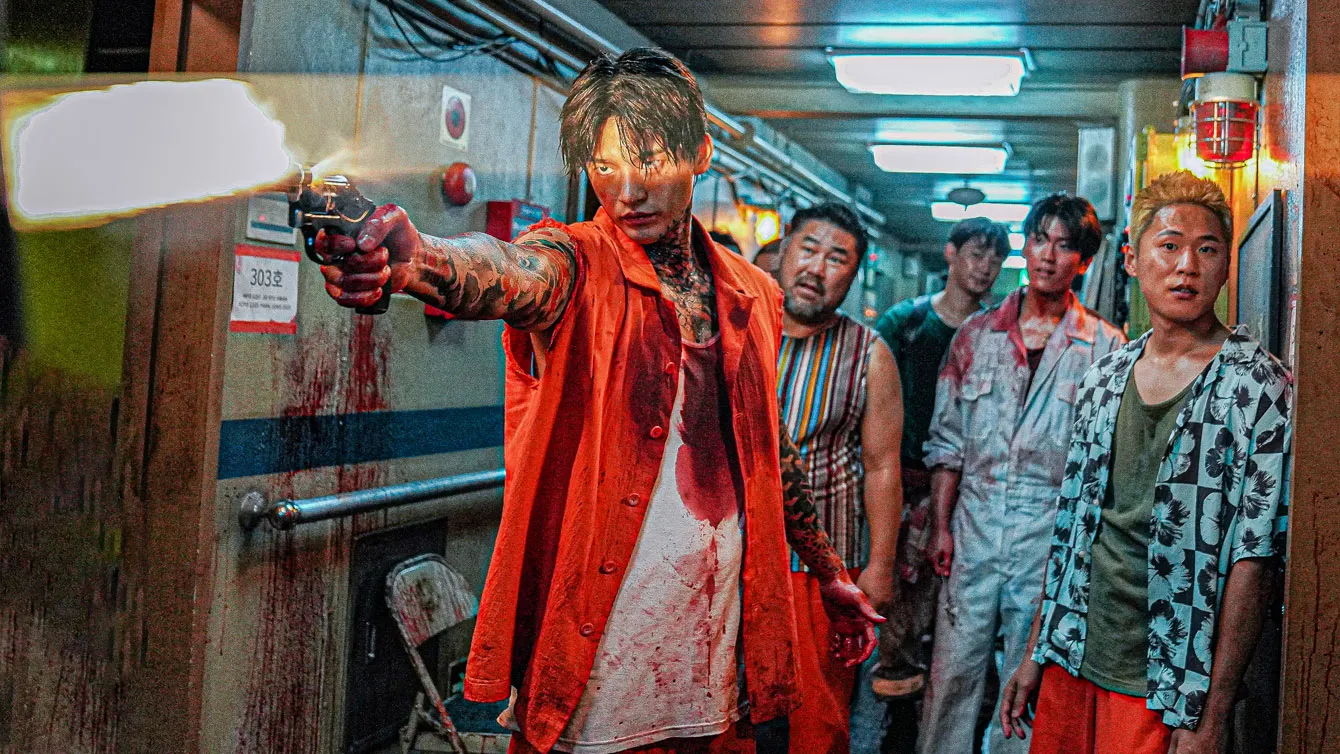 A group of bloodied convicts in Project Wolf Hunting, with one firing a pistol forwards