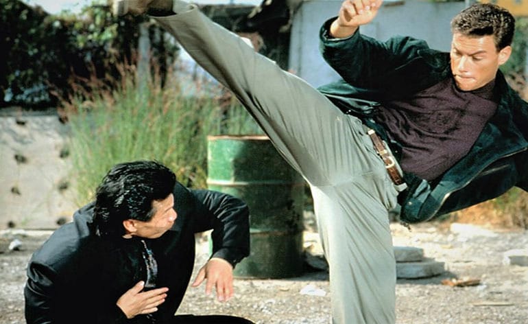 Bolo Yeung ducks under a Van Damme kick in Double Impact