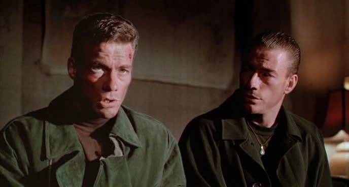 Two Van Dammes sit next to each other in Double Impact