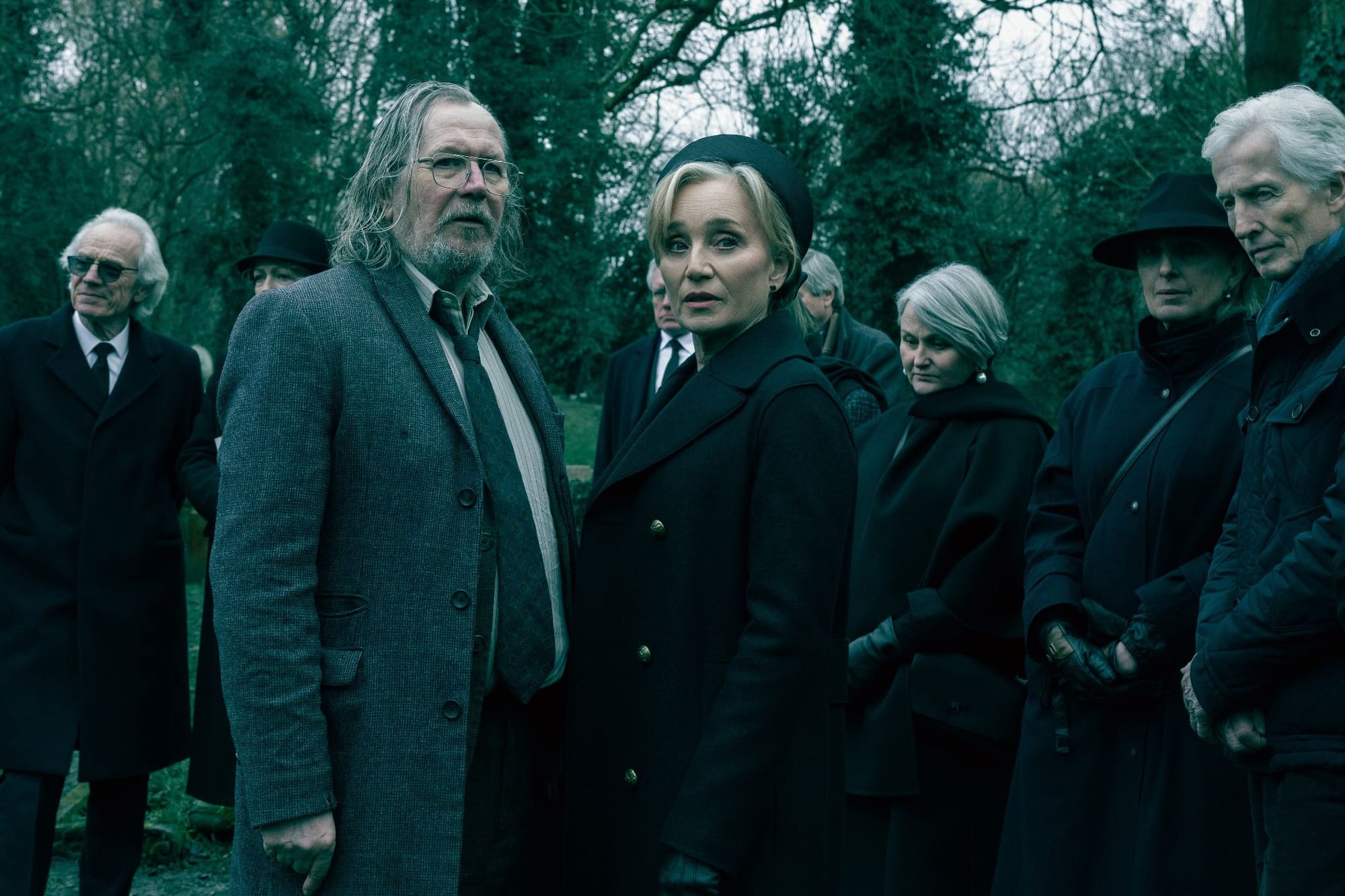 Gary Oldman and Kristin Scott Thomas at a funeral in Slow Horses