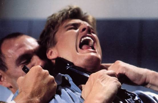 Dolph Lundgren gets strangled by an adversary in Cover-Up