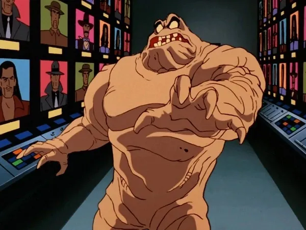 A scared-looking Clayface in a hallway filled with screens in Batman: The Animated Series