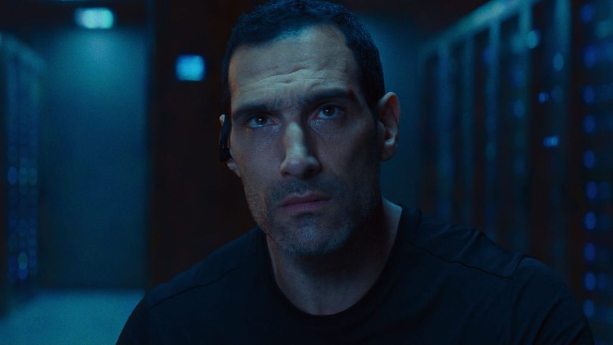 Marko Zaror, looking up while wearing an in-ear headset in Affinity