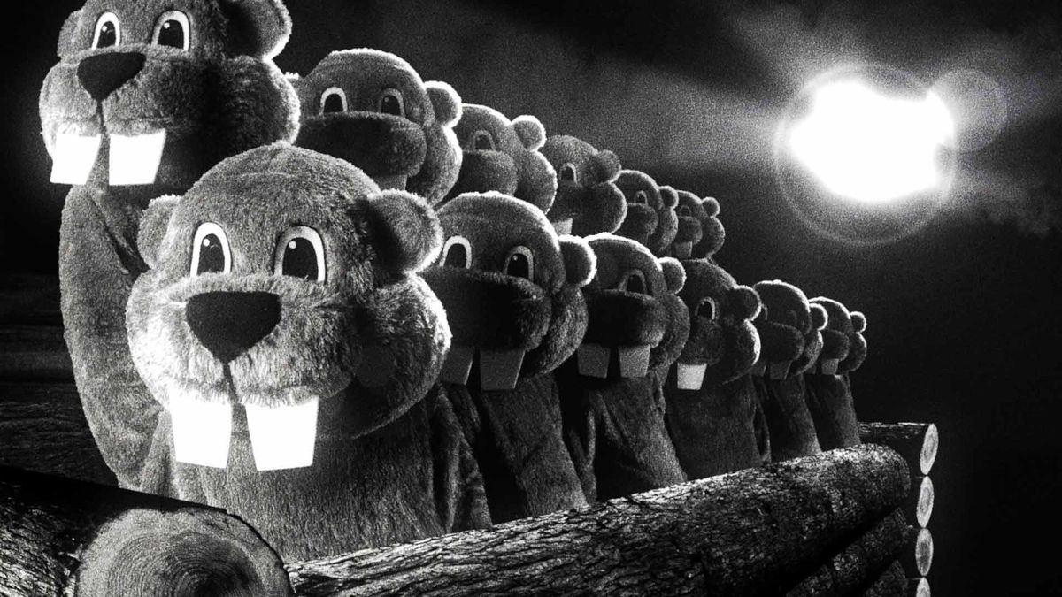 A group of beaver mascots holding the heads of other beaver mascots aloft in an oddly religious image from Hundreds of Beavers
