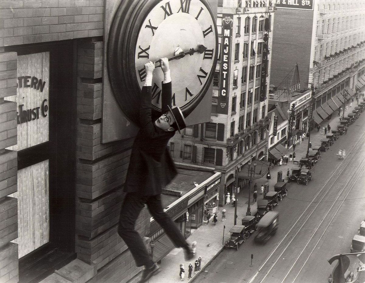 Harold Lloyd hanging from a clock in Safety Last!