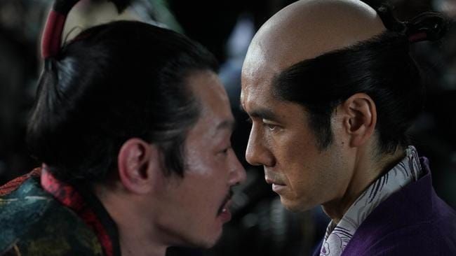 Two men nearly face-to-face in Kubi