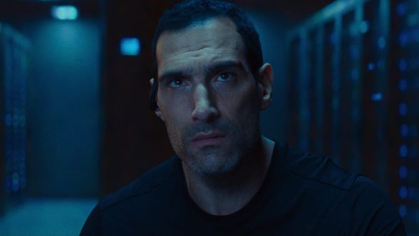 Marko Zaror, looking up while wearing an in-ear headset in Affinity