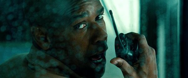 Denzel Washington talks into a walkie in Unstoppable