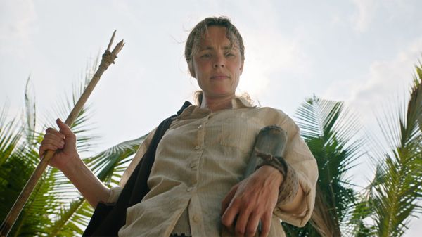 Rachel McAdams stands menacingly over the camera, holding a stick, in Send Help
