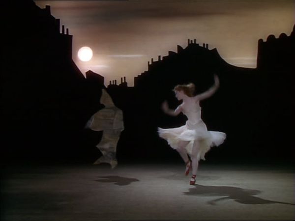 Moira Shearer dances with a shimmering figure in The Red Shoes